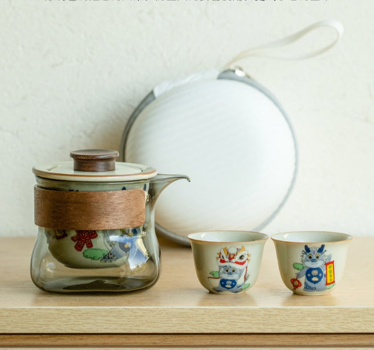 This is a ceramic teapot travel set