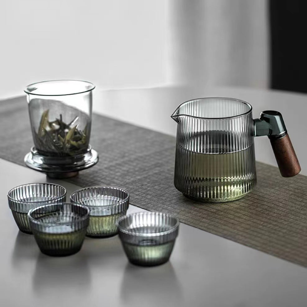 This is a glass teapot travel set