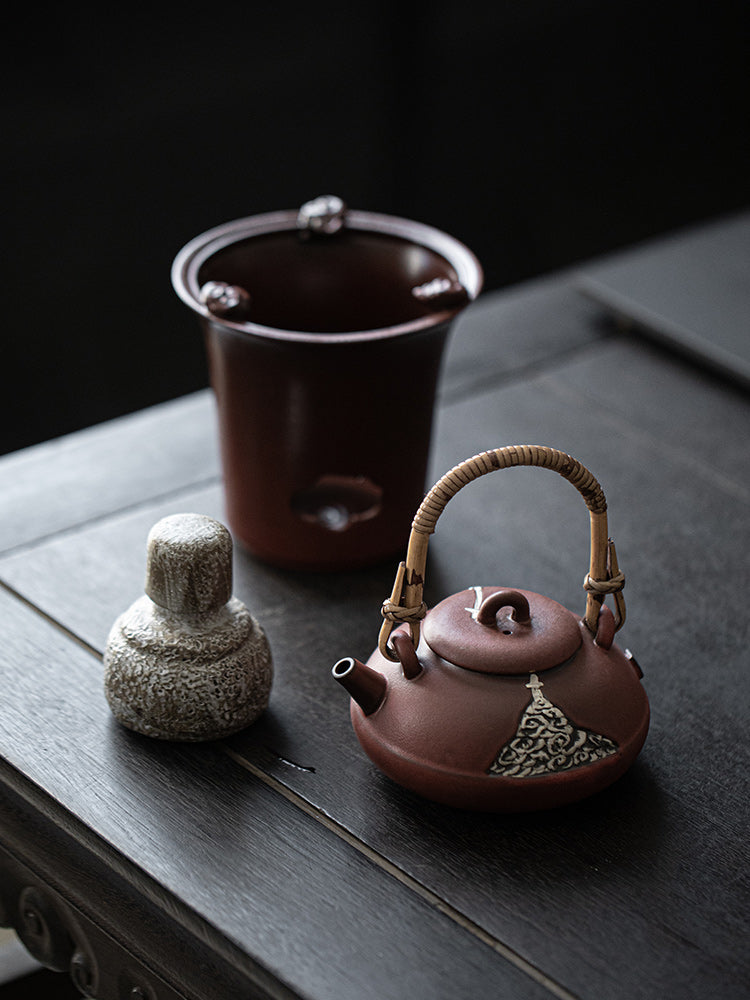 This is a pottery lifting handle kettle