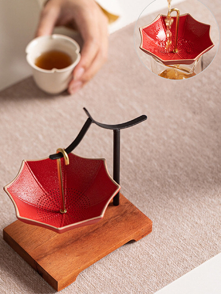 This is a ceramic umbrella shape tea filter tea strainer