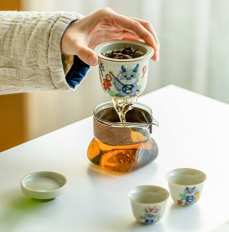 This is a ceramic teapot travel set