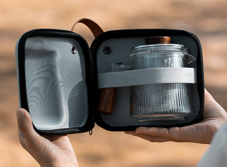 This is a glass teapot travel set