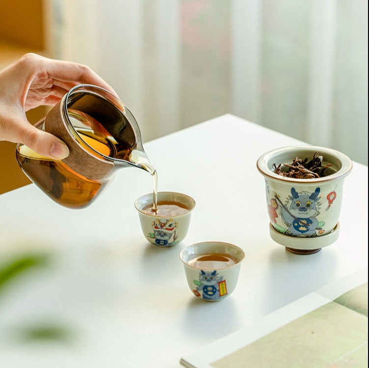 This is a ceramic teapot travel set