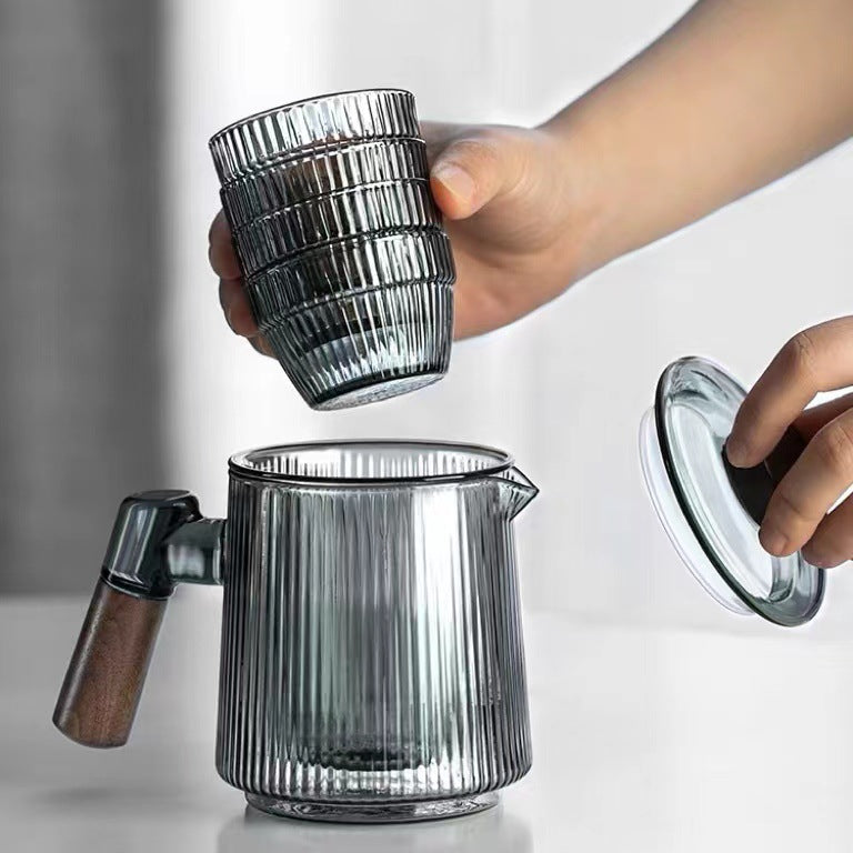 This is a glass teapot travel set