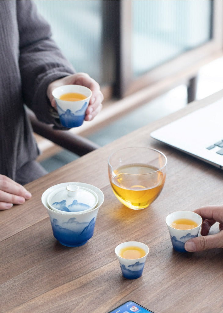 This is a ceramic gaiwan teapot travel set