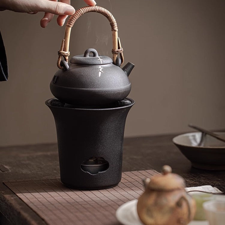 This is a pottery lifting handle kettle