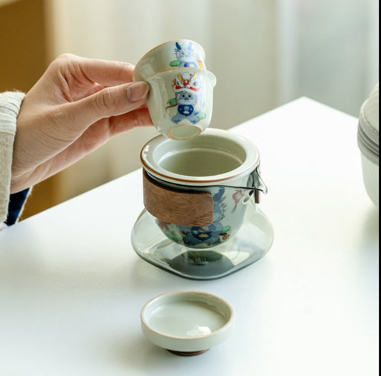 This is a ceramic teapot travel set