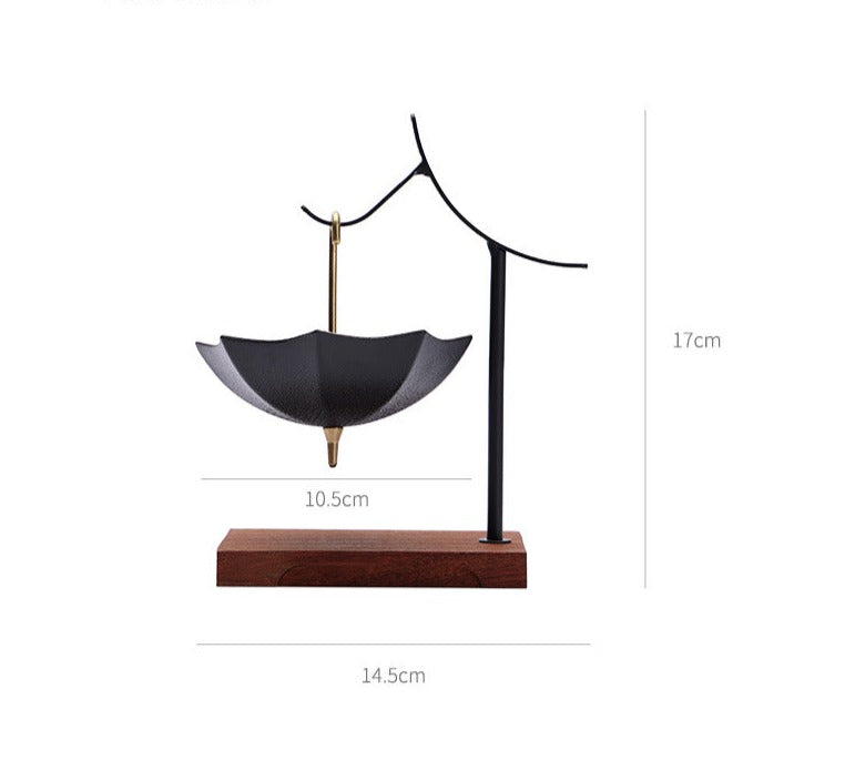 This is a ceramic umbrella shape tea filter tea strainer