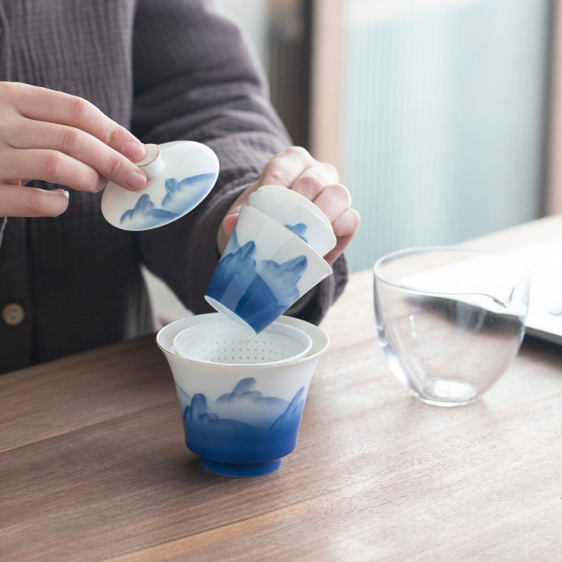 This is a ceramic gaiwan teapot travel set