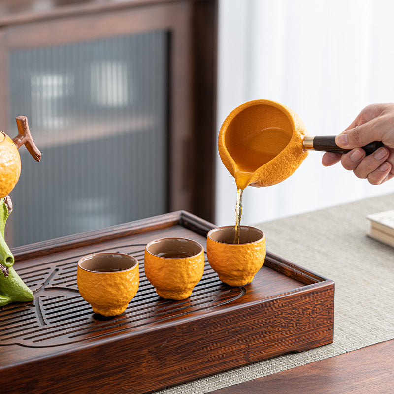 this is an automatic ceramic teapot.this is orange shape teapot