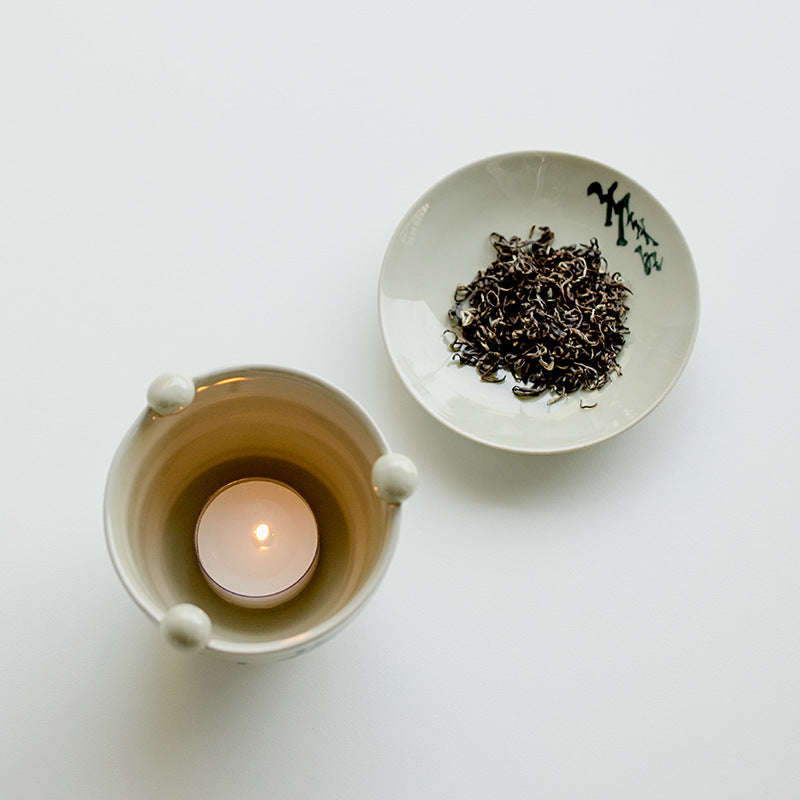 This is a ceramic scoop warmer set