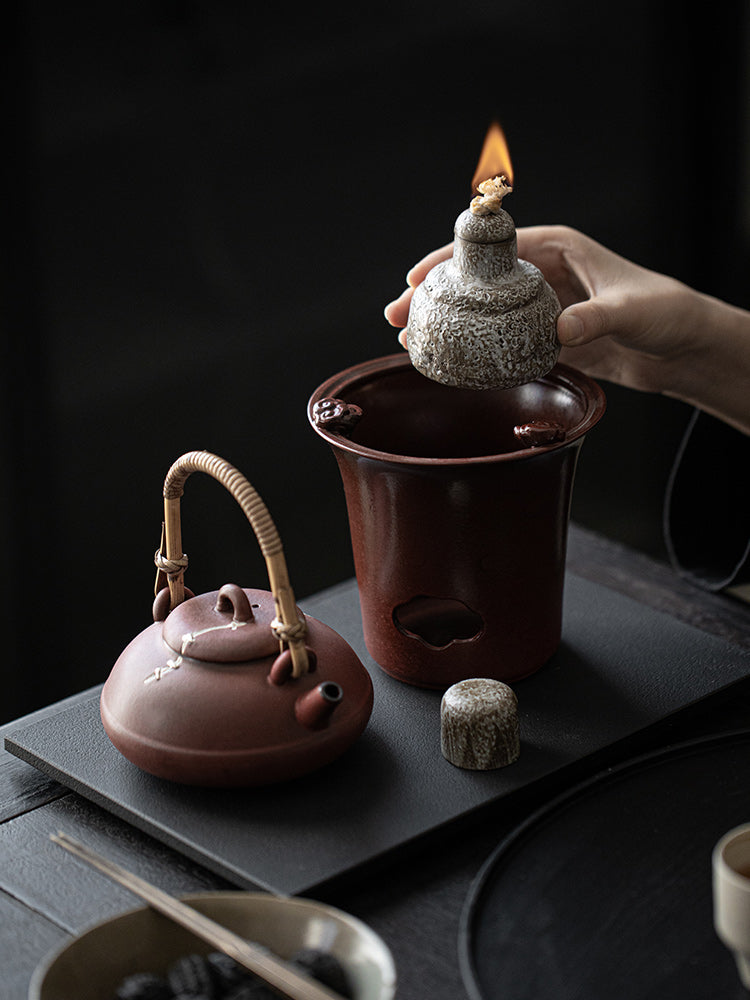 This is a pottery lifting handle kettle