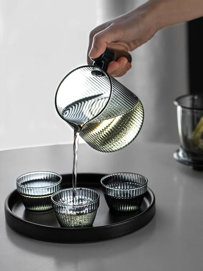 This is a glass teapot travel set