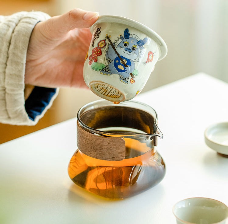This is a ceramic teapot travel set