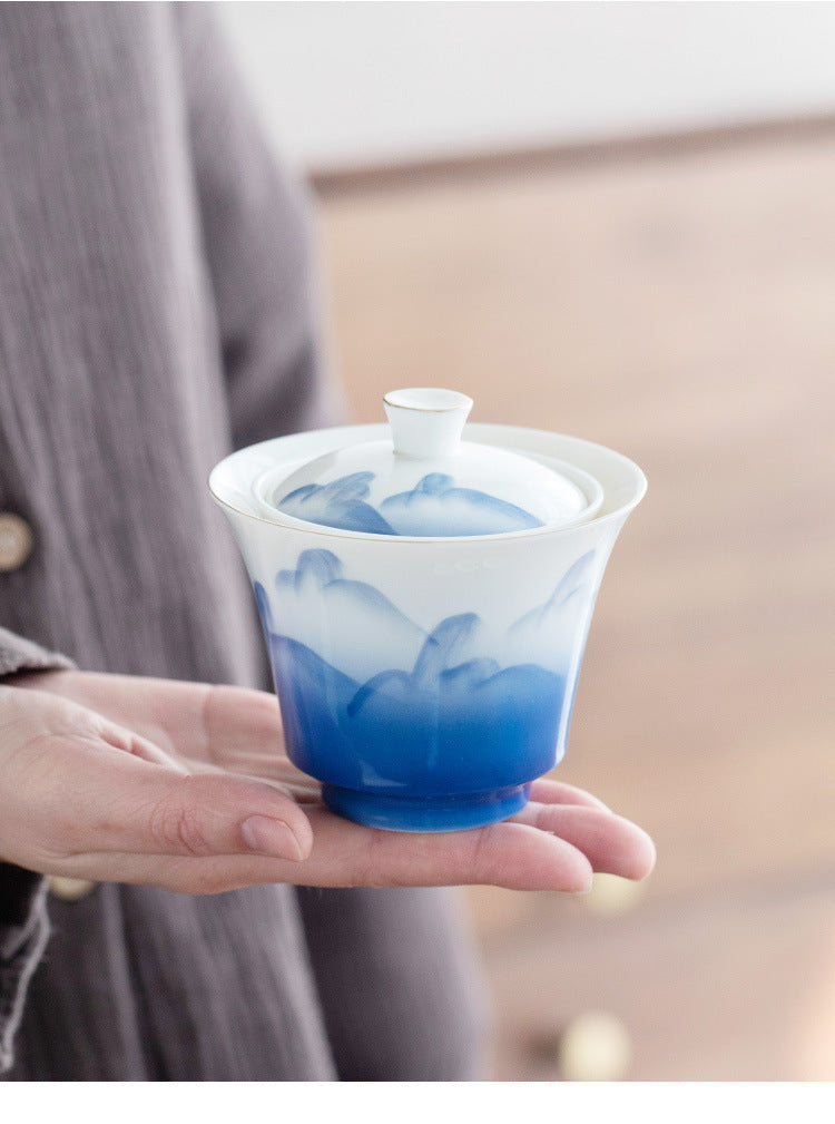This is a ceramic gaiwan teapot travel set