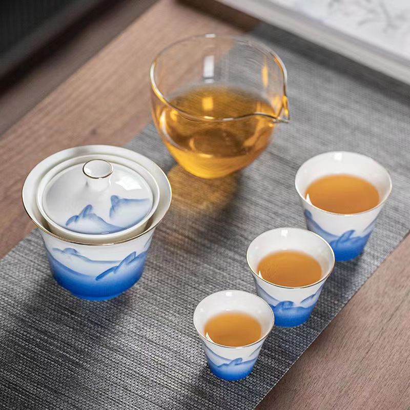 This is a ceramic gaiwan teapot travel set