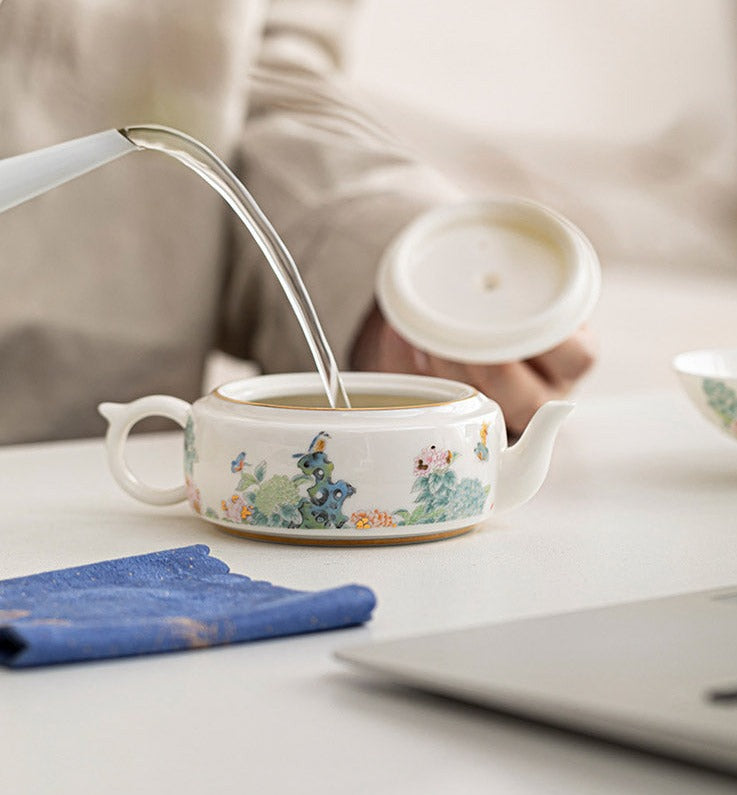 This is a ceramic teapot set