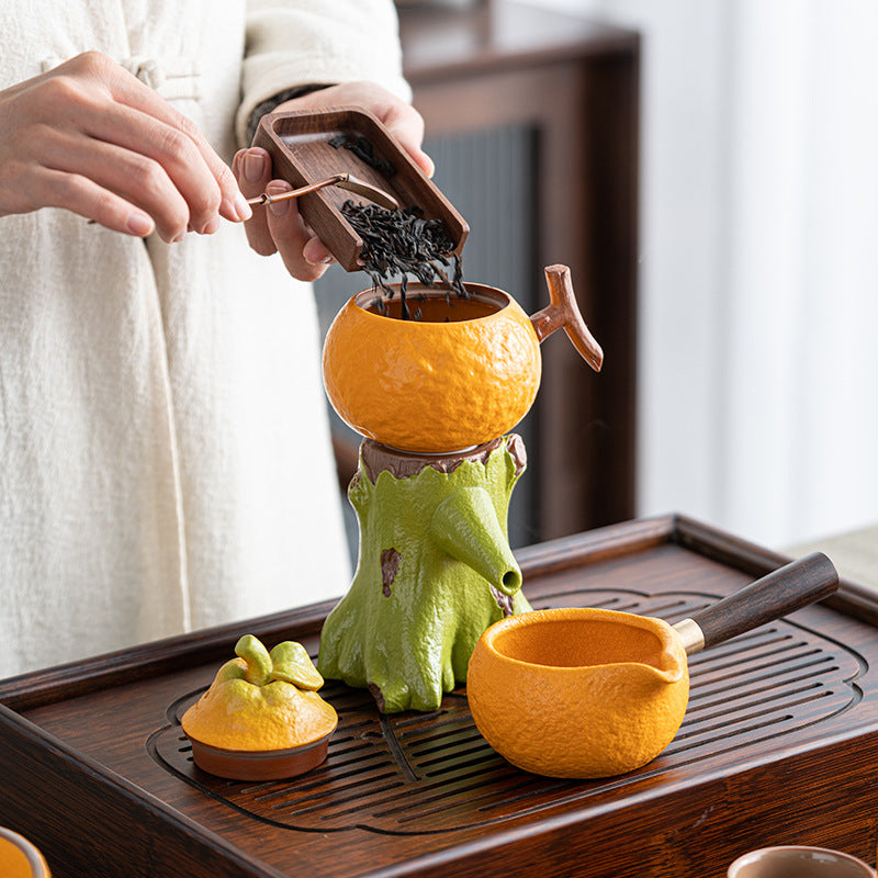 this is an automatic ceramic teapot.this is orange shape teapot