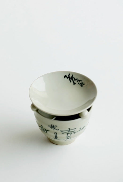 This is a ceramic scoop warmer set