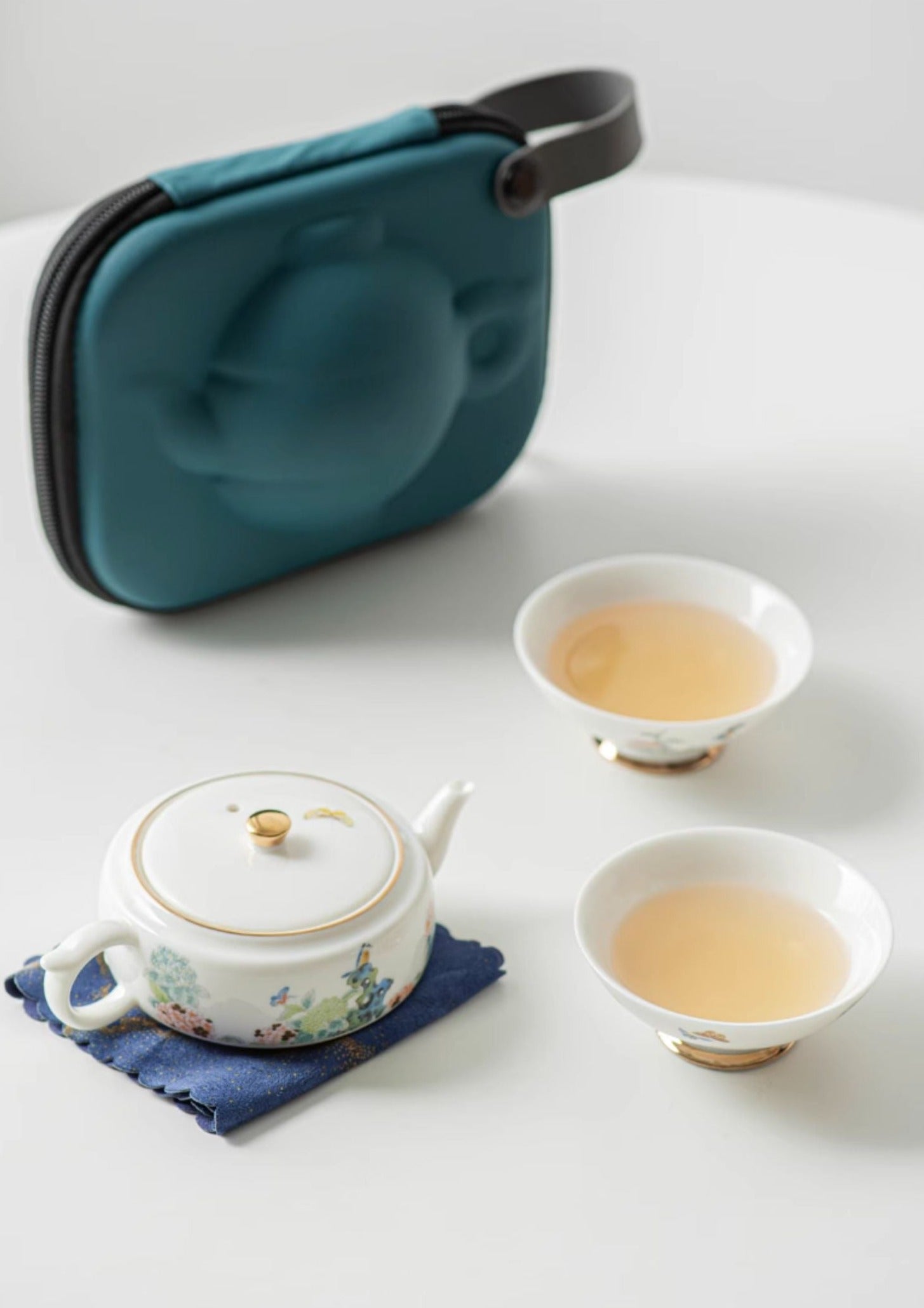 This is a ceramic teapot set