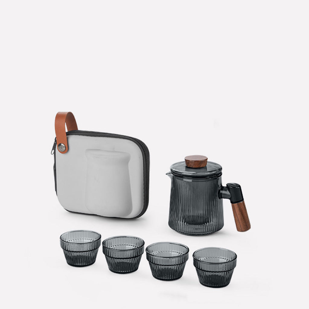 This is a glass teapot travel set