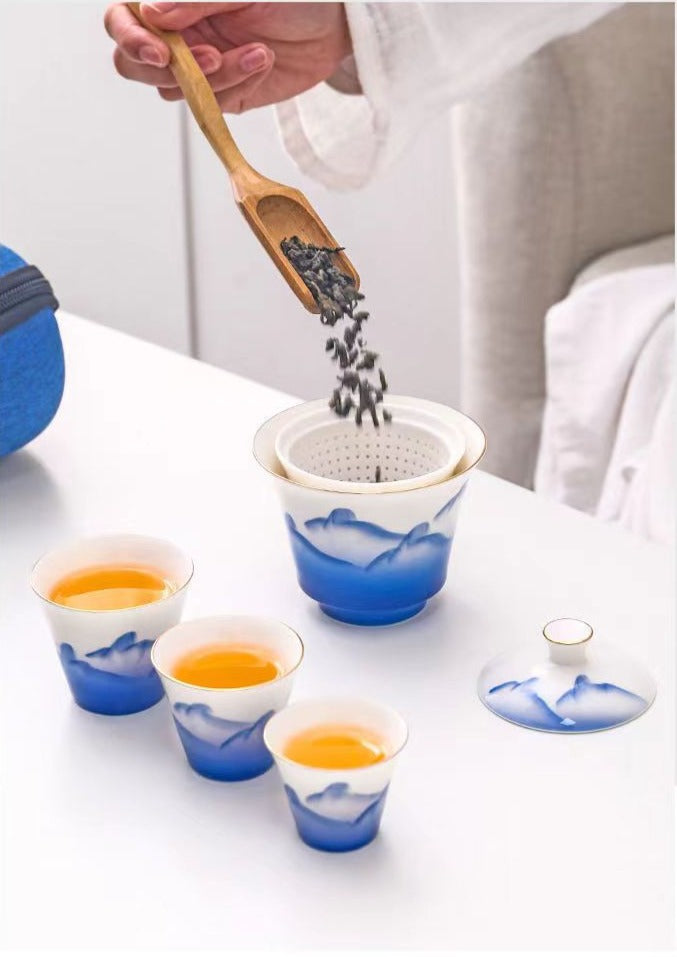 This is a ceramic gaiwan teapot travel set