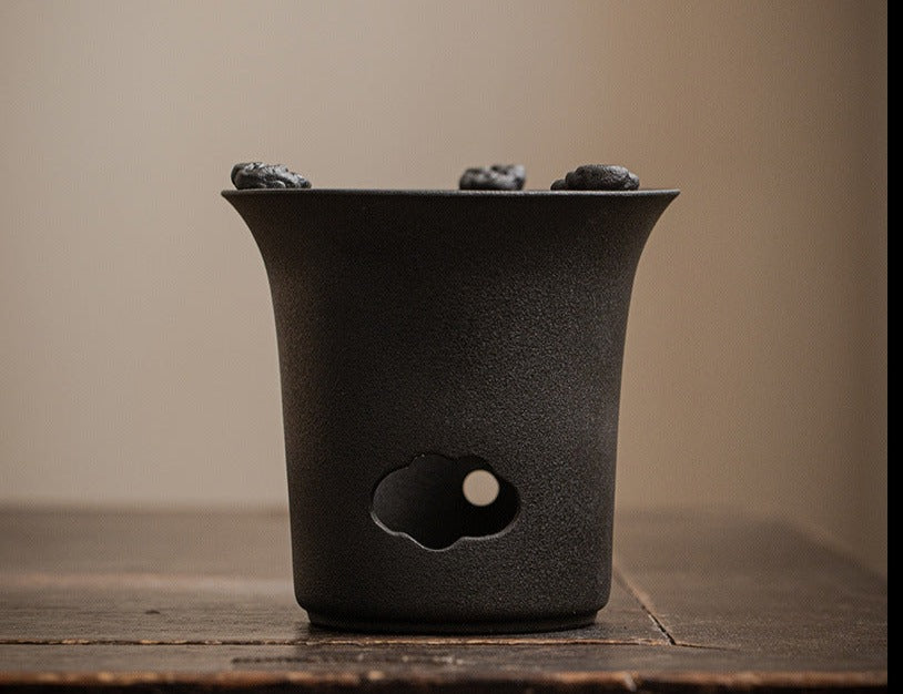 This is a pottery lifting handle kettle