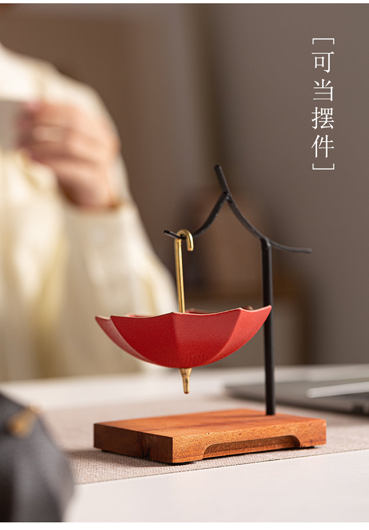 This is a ceramic umbrella shape tea filter tea strainer