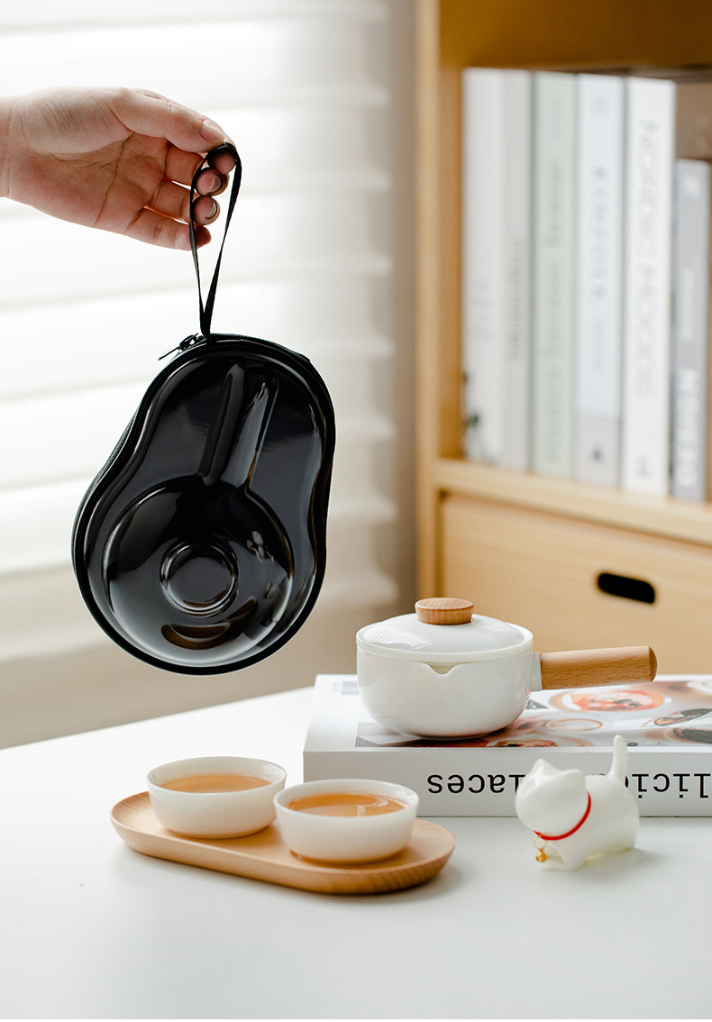 This is a ceramic teapot travel set
