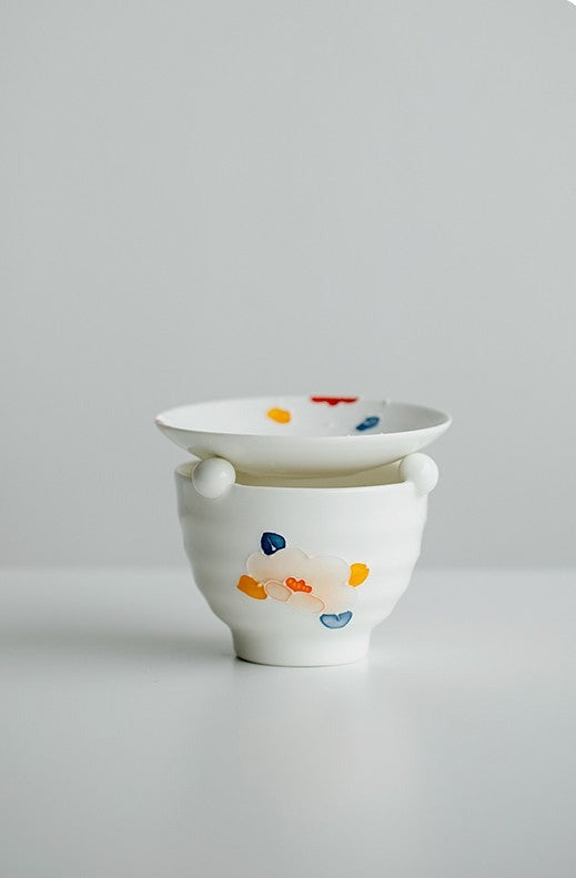 This is a ceramic scoop warmer set