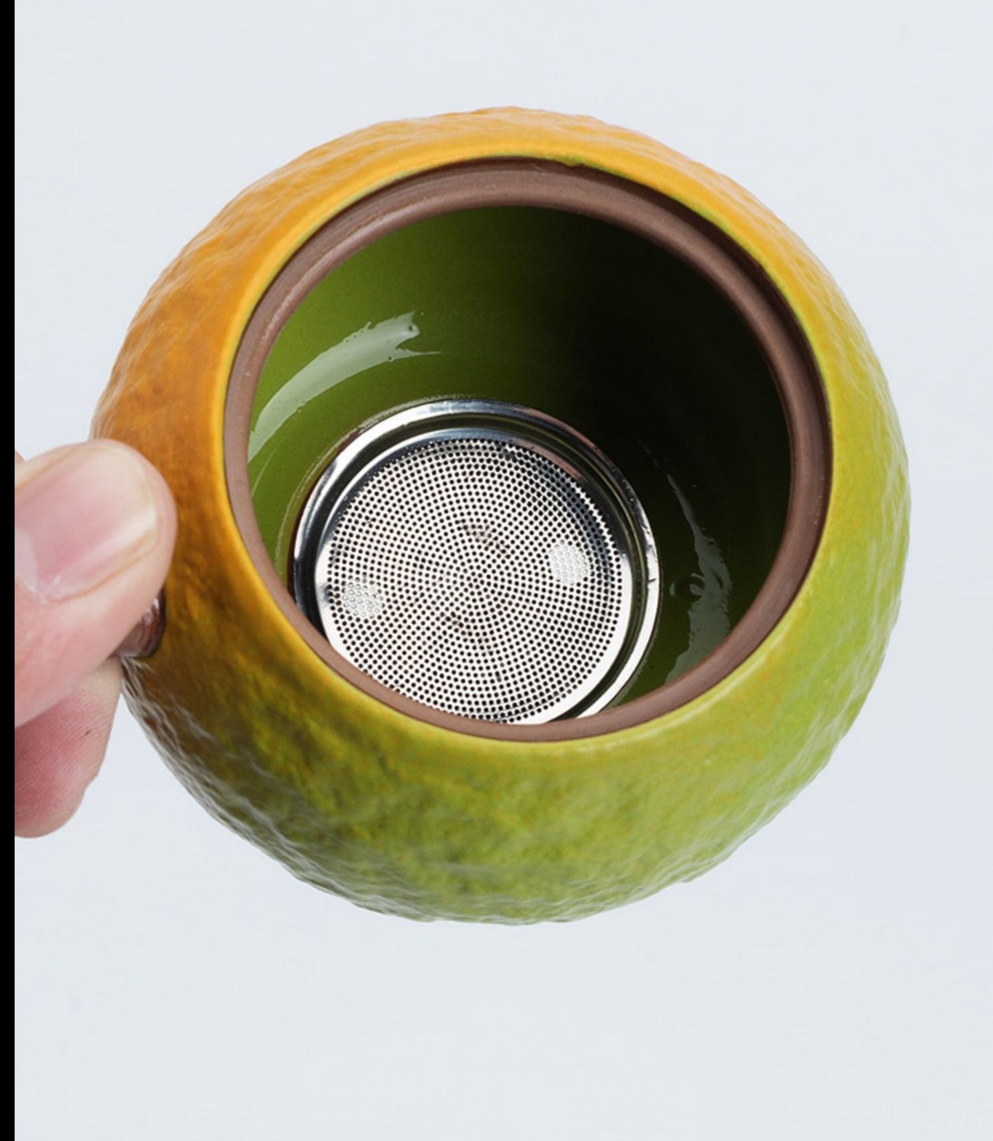 this is an automatic ceramic teapot.this is orange shape teapot