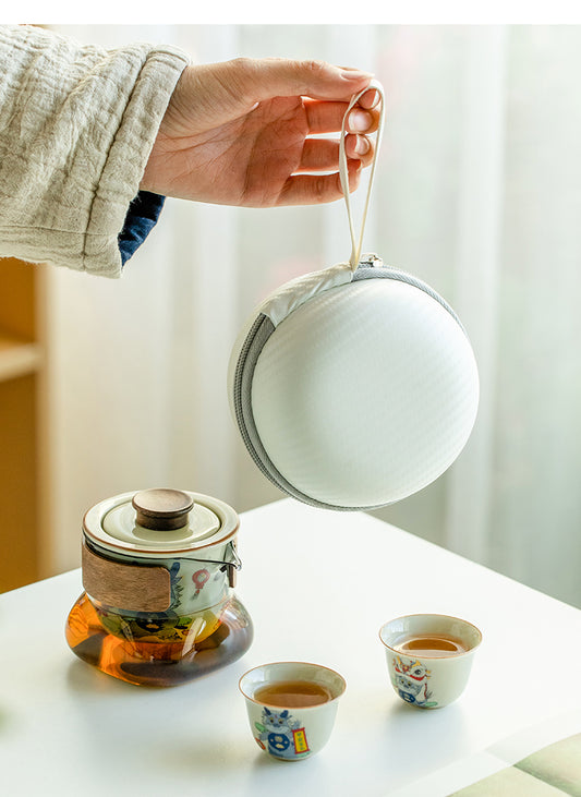 This is a ceramic teapot travel set