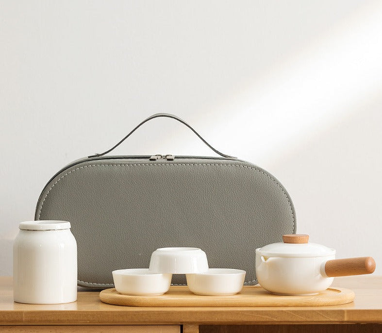 This is a ceramic teapot travel set