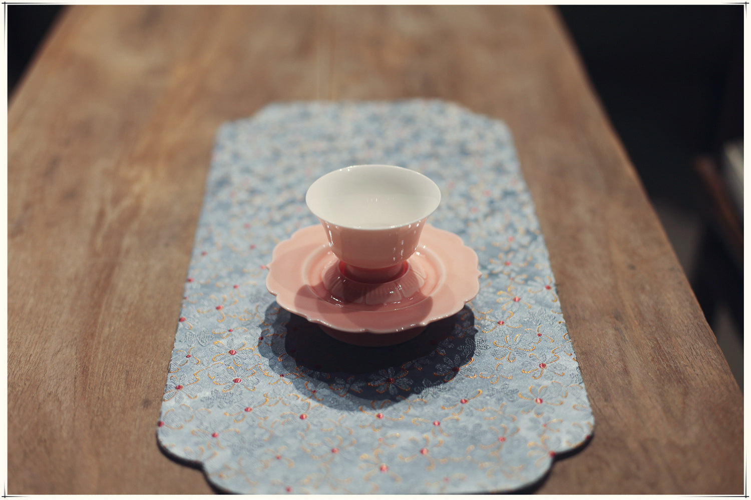 this is a pink ceramic teapot