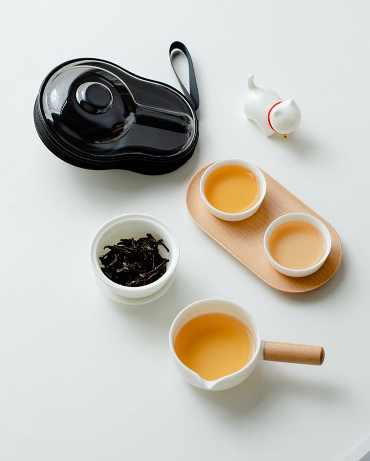 This is a ceramic teapot travel set