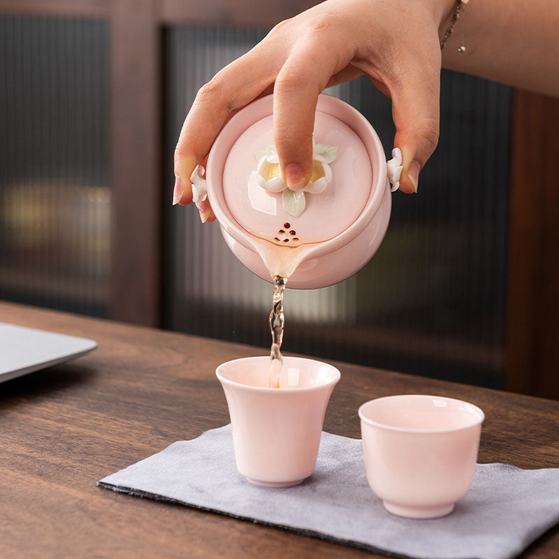 This is a ceramic teapot travel set