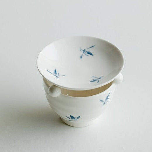 This is a ceramic scoop warmer set