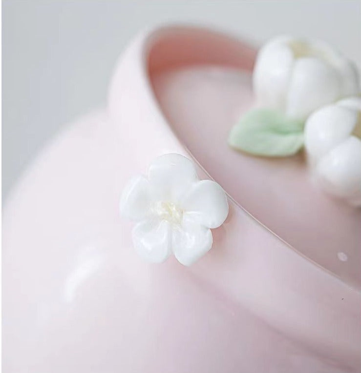 This is a ceramic teapot travel set