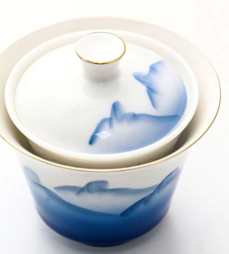 This is a ceramic gaiwan teapot travel set