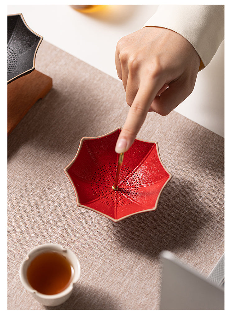 This is a ceramic umbrella shape tea filter tea strainer