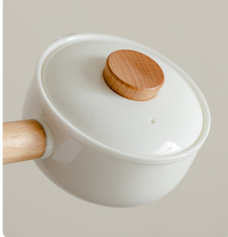 This is a ceramic teapot travel set