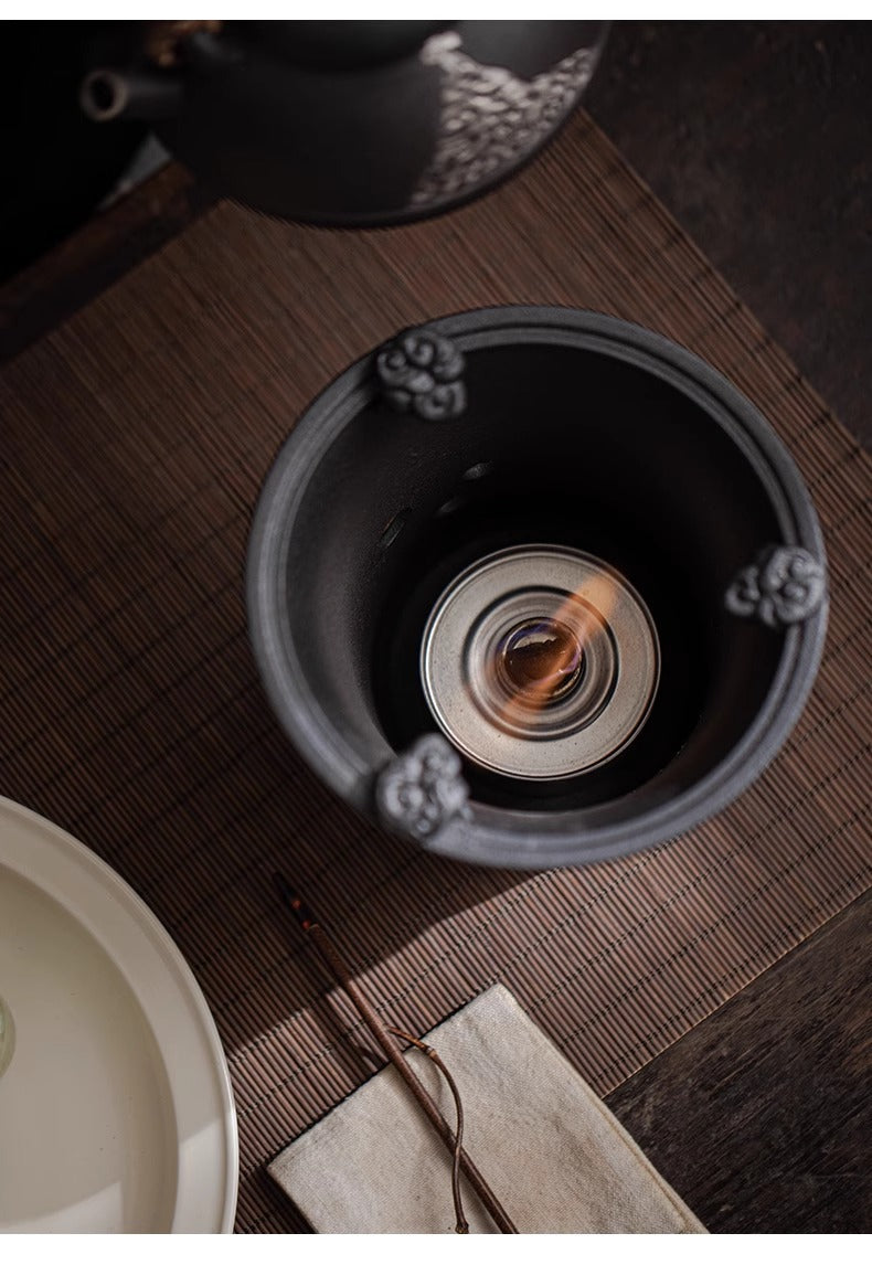 This is a pottery lifting handle kettle