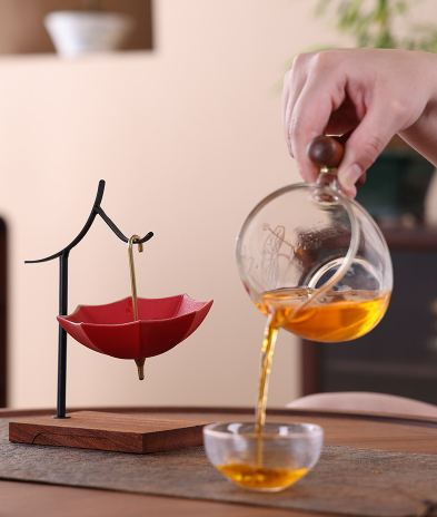 This is a ceramic umbrella shape tea filter tea strainer
