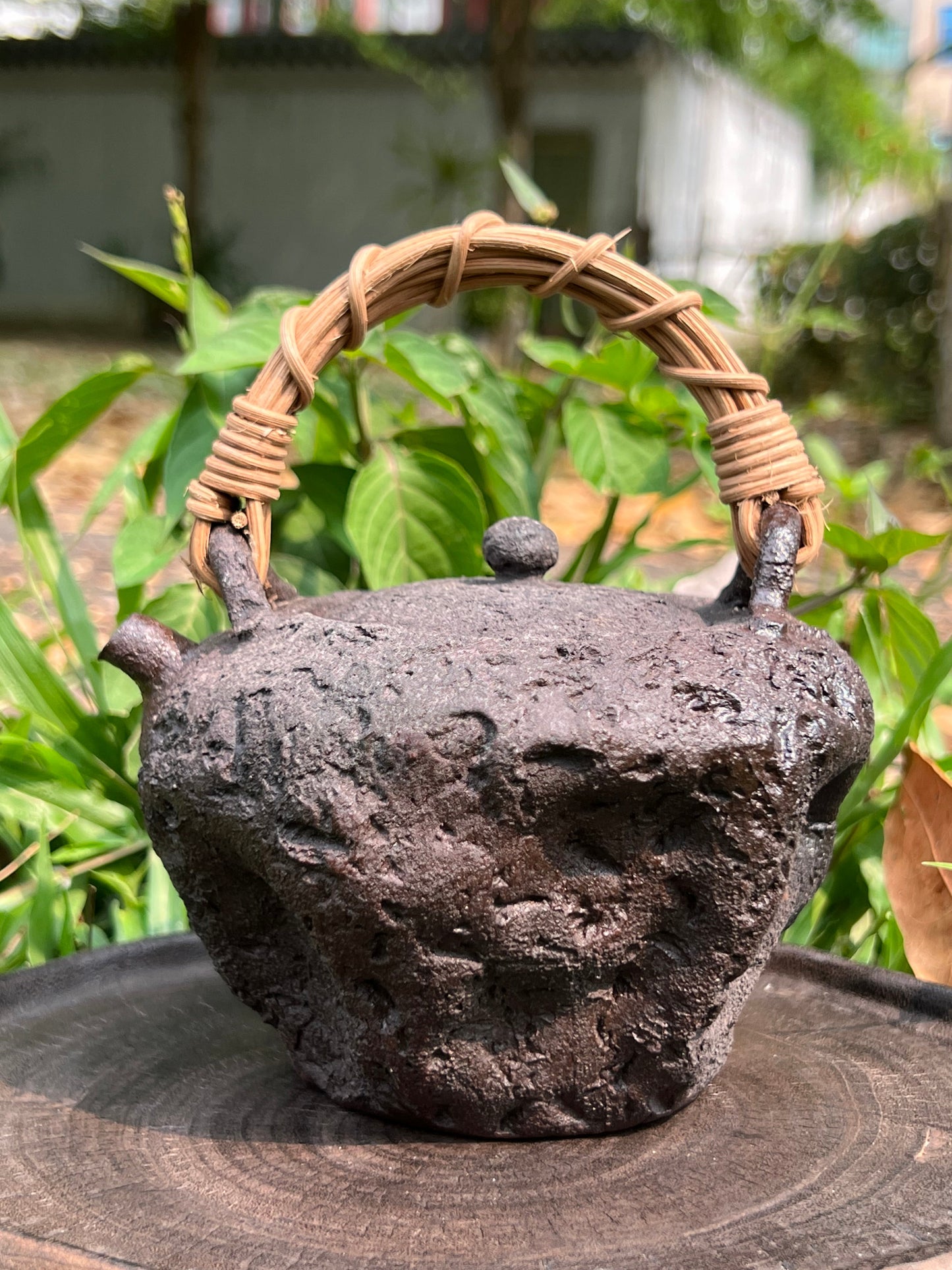 This is a pottery lifting handle kettle