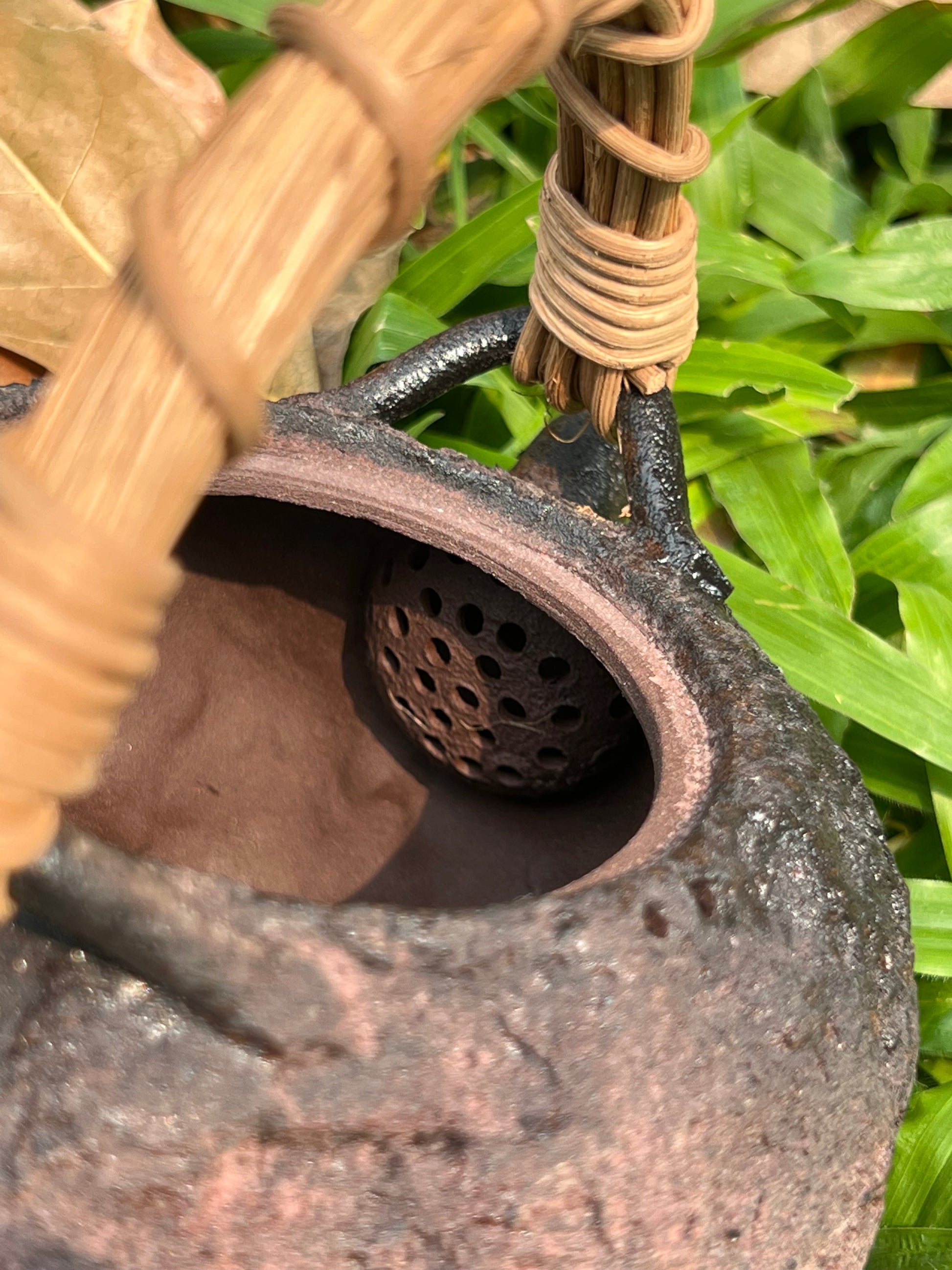 This is a pottery lifting handle kettle