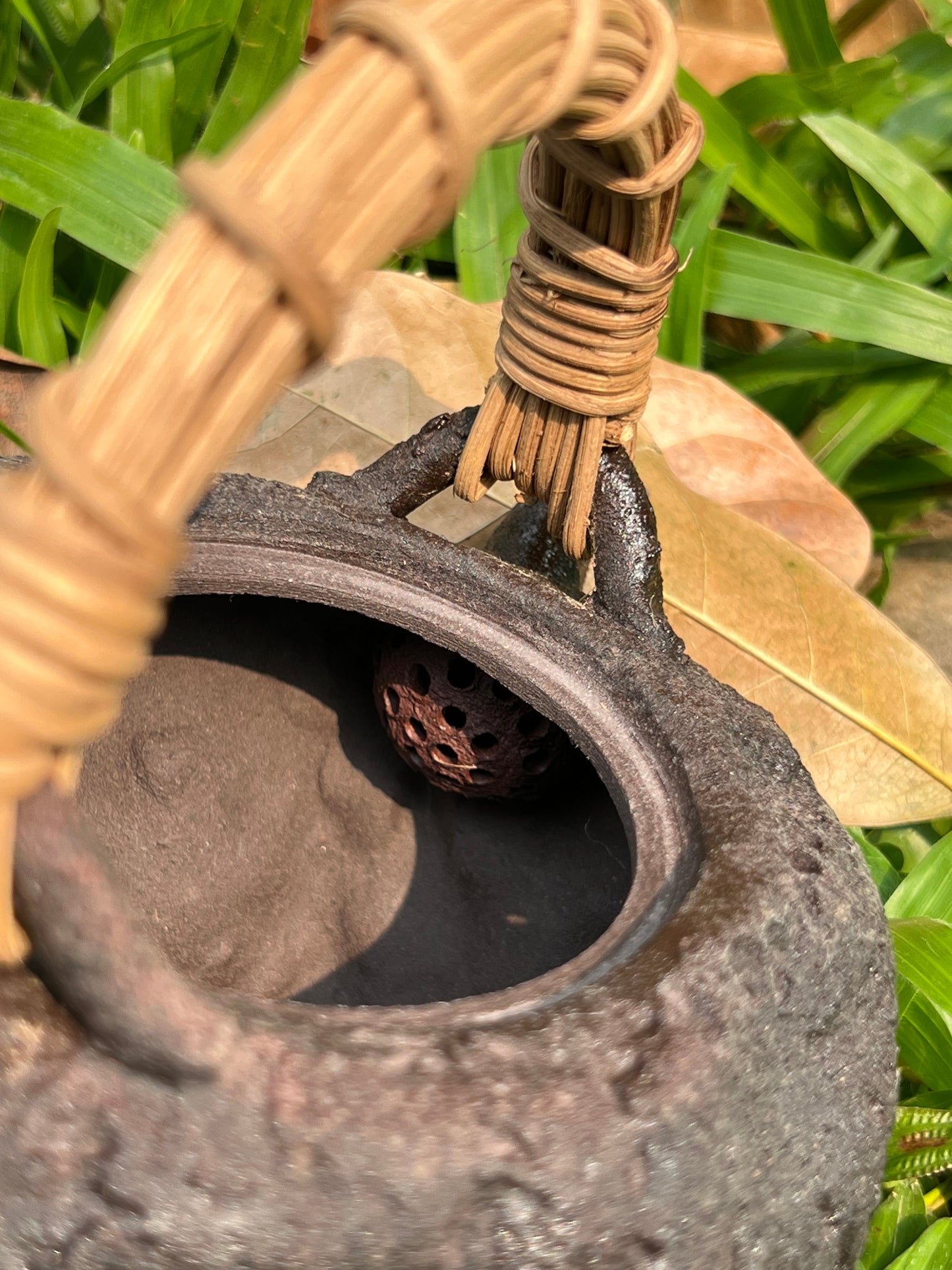 This is a pottery lifting handle kettle