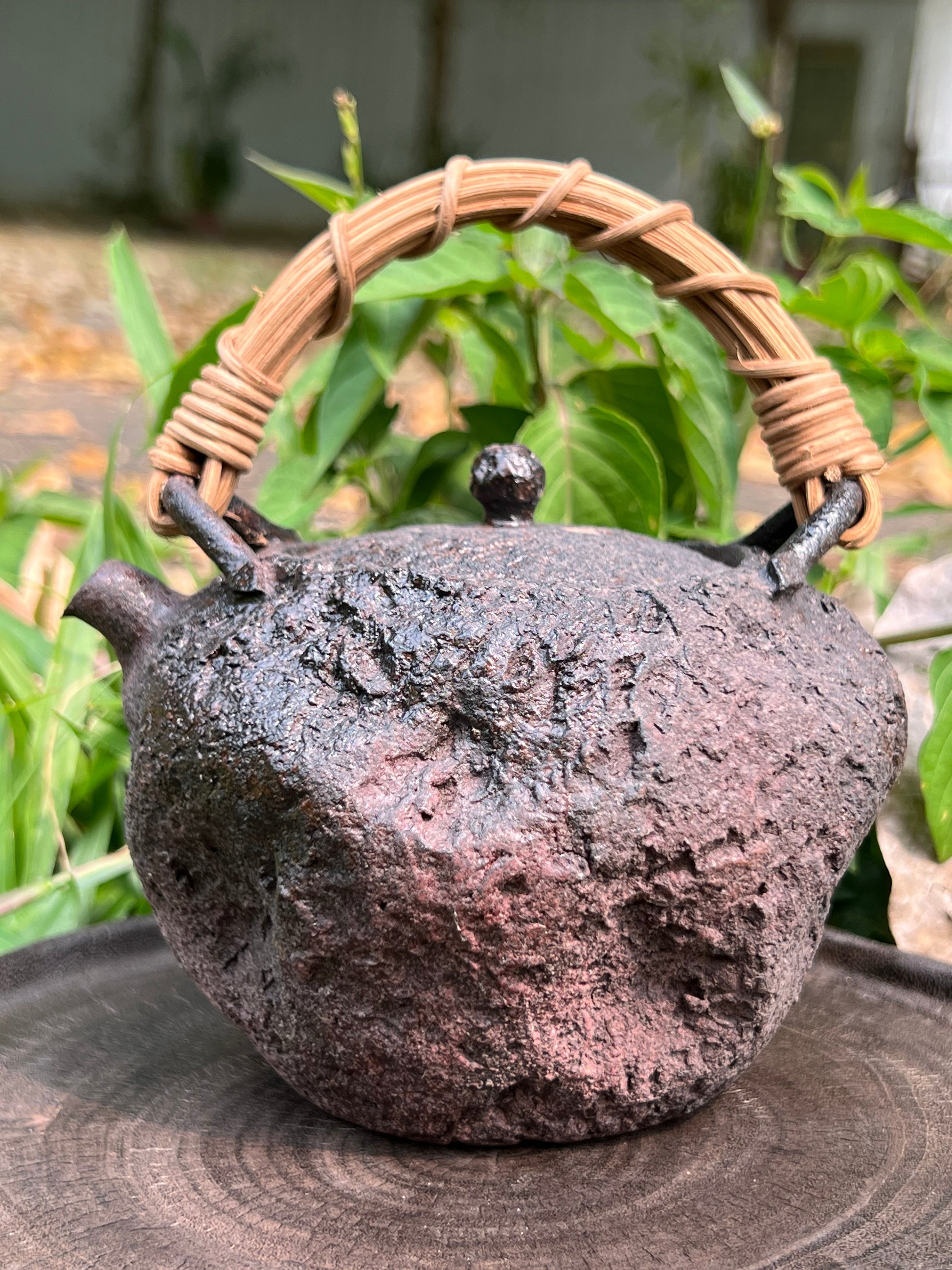 This is a pottery lifting handle kettle