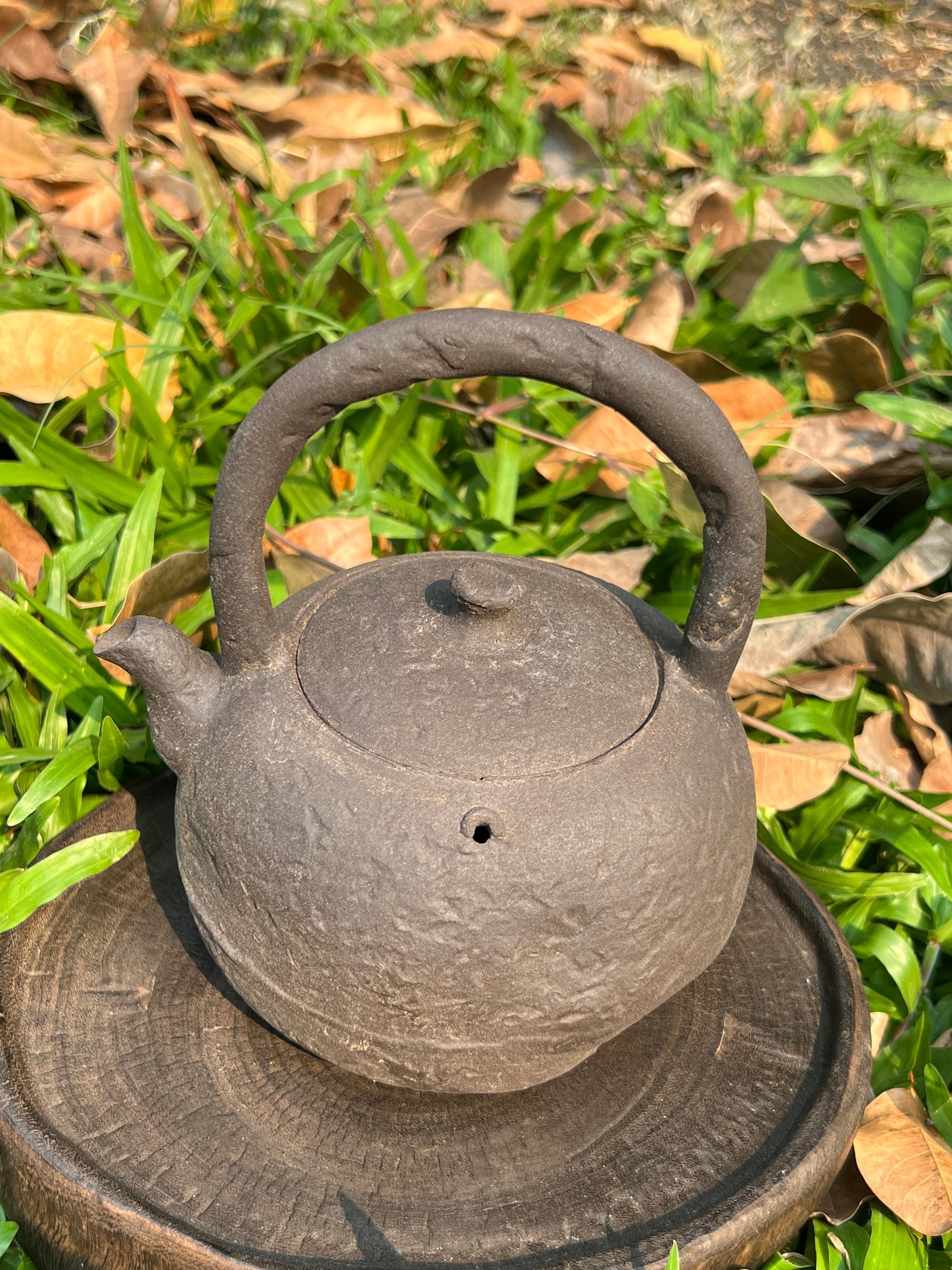 This is a pottery lifting handle kettle