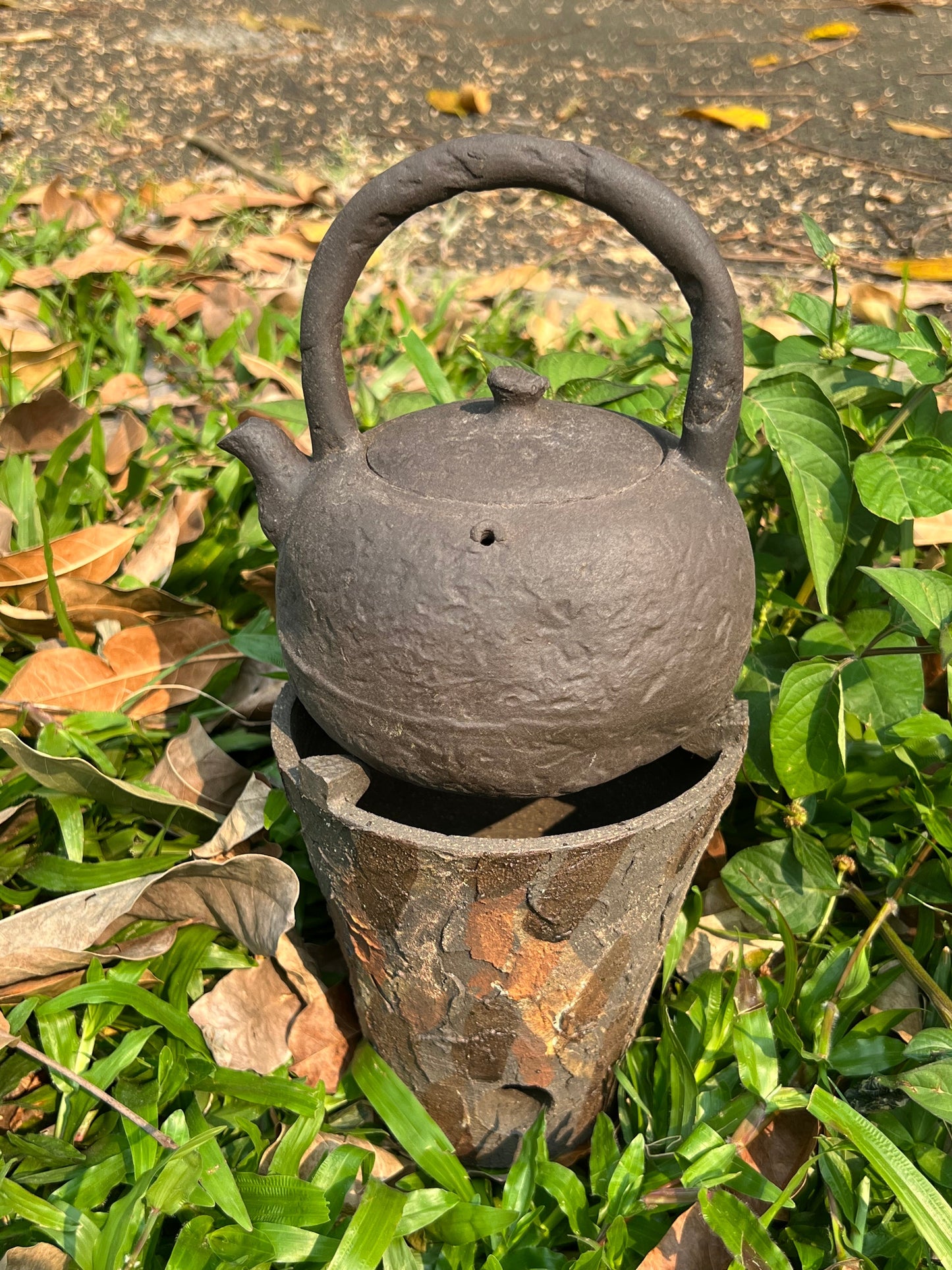 This is a pottery lifting handle kettle