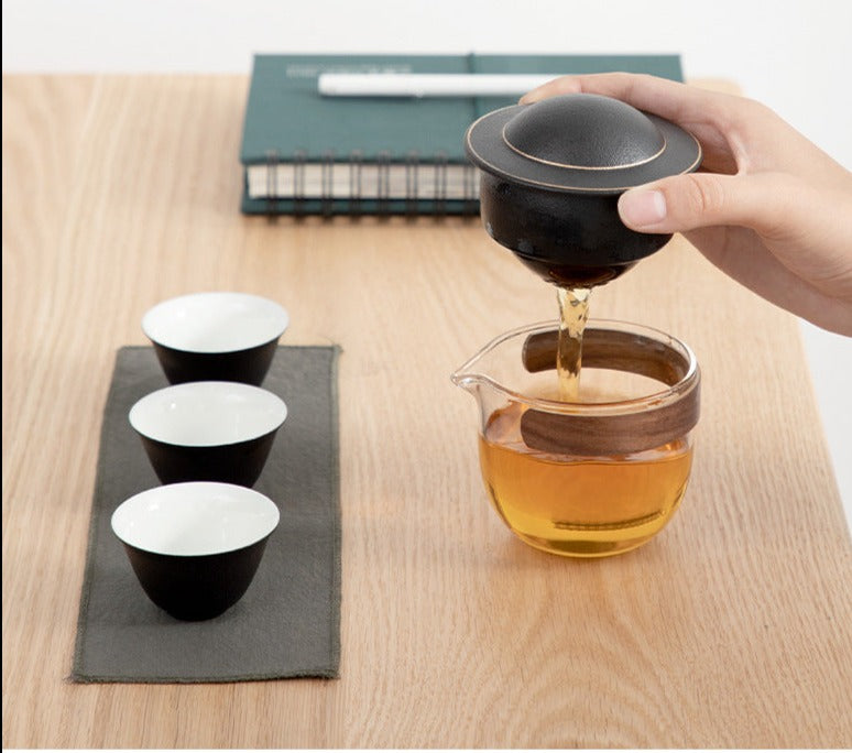 This is a glass teapot travel set